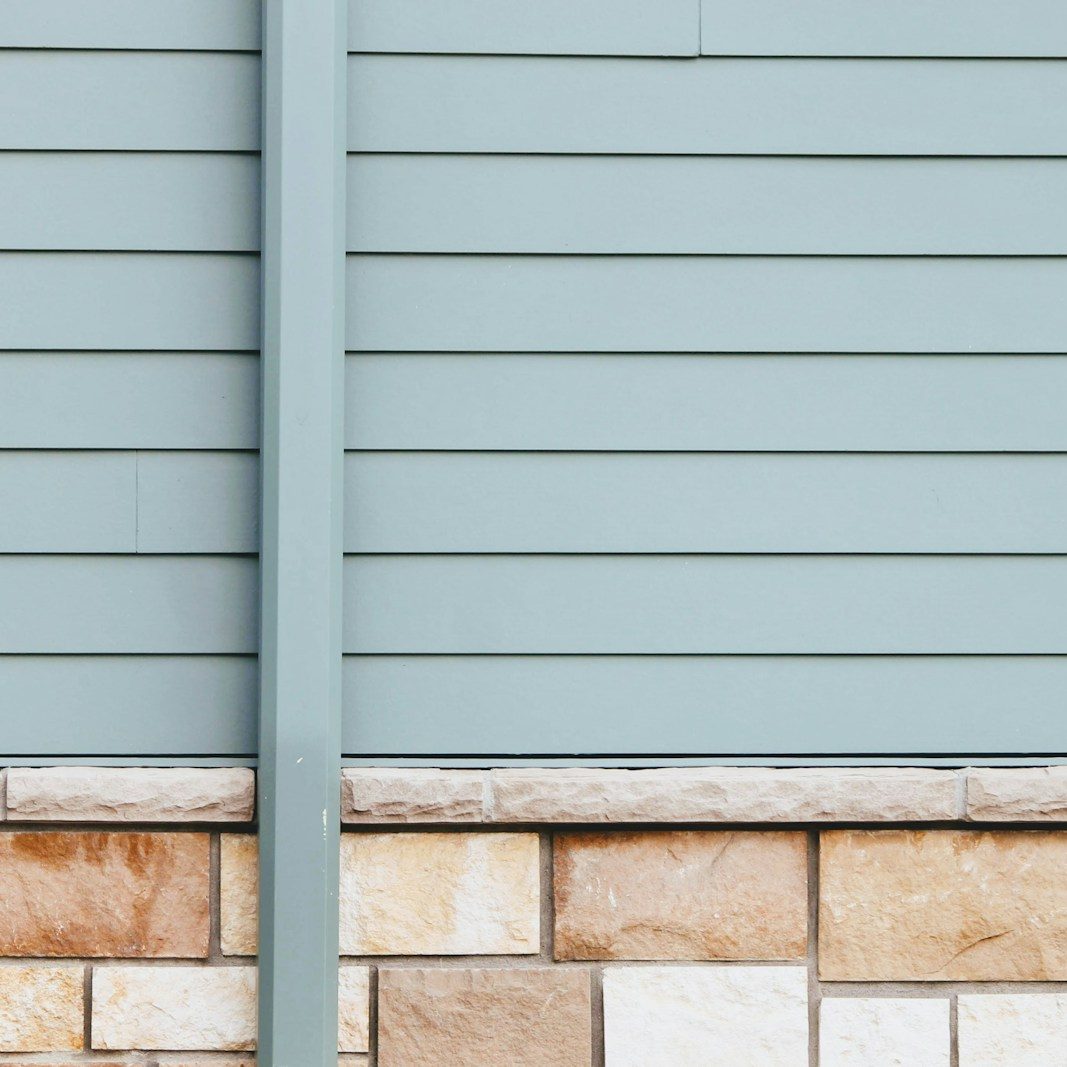 white wooden window frame on white brick wall